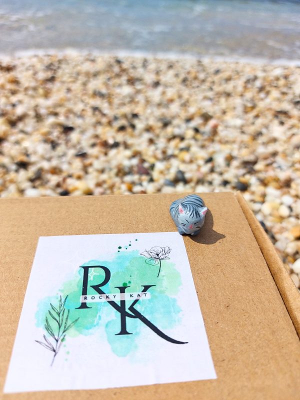 Handmade Grey and White Clay Cat Figurine - On our box